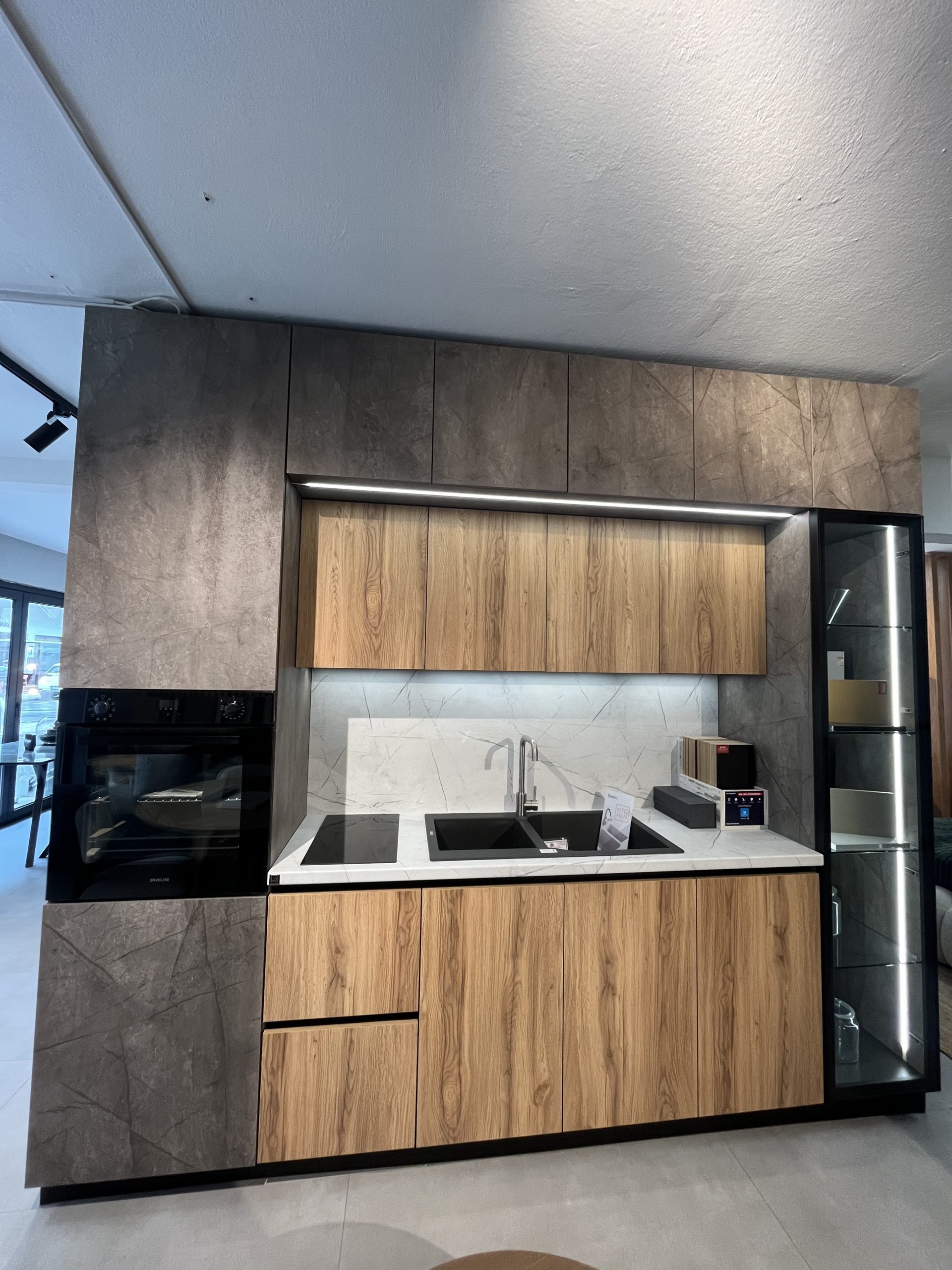 Kitchen with double row of two-tone cabinets