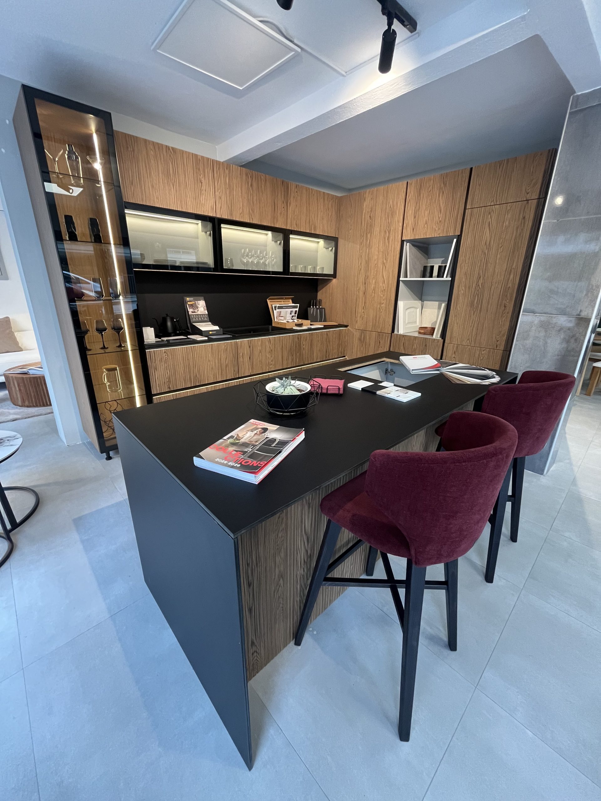 Kitchen with island, LED-lit display cabinets